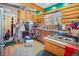 Functional kitchen featuring stainless steel appliances, a gas stove, and wooden cabinets at 6100 Bear Paw Rd, Golden, CO 80403
