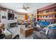 Cozy living room showcasing comfortable seating, wooden furniture, and a fireplace at 6100 Bear Paw Rd, Golden, CO 80403