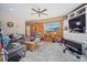 Inviting living room featuring a cozy atmosphere, wooden decor, and natural light from the window at 6100 Bear Paw Rd, Golden, CO 80403