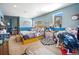 Bright bedroom featuring a comfortable bed, natural light, and unique decor for a cozy atmosphere at 6100 Bear Paw Rd, Golden, CO 80403