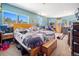 Spacious primary bedroom with ample natural light, comfortable bed, and scenic outdoor views at 6100 Bear Paw Rd, Golden, CO 80403
