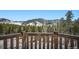 Breathtaking mountain view from the wooden porch, surrounded by a lush forest landscape at 6100 Bear Paw Rd, Golden, CO 80403