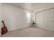 Cozy bedroom with a window, closet, and neutral decor at 1469 Hummingbird Cir, Brighton, CO 80601