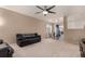 Open living room and kitchen with a view into the dining area at 1469 Hummingbird Cir, Brighton, CO 80601