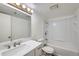 Bright bathroom with new vanity, sink, toilet, and shower-tub combo at 9374 W Friend Dr, Littleton, CO 80128