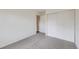 Carpeted bedroom featuring a large closet and doorway to another room at 9374 W Friend Dr, Littleton, CO 80128