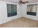 Neutral bedroom with ceiling fan and dual windows allowing ample natural light at 680 Kalmia Way, Broomfield, CO 80020