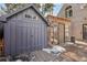 Features include a shed with a detailed door, a greenhouse, and a patio at 916 Griffith St, Georgetown, CO 80444