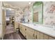 Charming bathroom with floral wallpaper, a spacious vanity, and vintage fixtures at 916 Griffith St, Georgetown, CO 80444