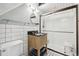 Modern bathroom with tiled walls, a glass-enclosed shower, and a stylish vanity at 916 Griffith St, Georgetown, CO 80444