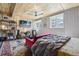 Bright bedroom with wood paneled ceiling, comfortable bed, desk, and stylish decor at 916 Griffith St, Georgetown, CO 80444