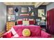 Cozy bedroom featuring unique cat-themed decor and comfortable pink sofa at 916 Griffith St, Georgetown, CO 80444