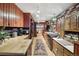 Spacious kitchen with wooden cabinets and brick accents at 916 Griffith St, Georgetown, CO 80444