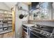 Kitchen featuring a stainless steel oven and range, wood cabinets, and walk-in pantry at 916 Griffith St, Georgetown, CO 80444