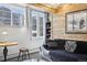 Cozy living room with wood-paneled walls, comfortable seating, and mountain views at 916 Griffith St, Georgetown, CO 80444