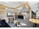 Spacious living room featuring wood accents, bar, and large windows for natural light at 916 Griffith St, Georgetown, CO 80444
