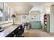 Bright office space with an angled ceiling, vintage furniture, and natural light at 916 Griffith St, Georgetown, CO 80444