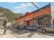 Street view of historic brick buildings with storefronts and parked cars at 916 Griffith St, Georgetown, CO 80444