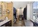 Well-organized walk-in closet with wooden accents, ample storage, and natural light at 916 Griffith St, Georgetown, CO 80444