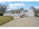 Charming home features a white exterior, concrete driveway, and fenced-in yard at 3075 S Emerson Way, Englewood, CO 80113