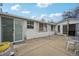 Back of house featuring sliding glass door, and white siding with an exterior deck and patio at 3075 S Emerson Way, Englewood, CO 80113