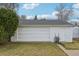 Detached one-car garage with lush surrounding landscape at 3075 S Emerson Way, Englewood, CO 80113