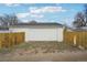 One-car garage, set back from the home, for convenient parking and storage at 3075 S Emerson Way, Englewood, CO 80113