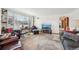 Bright living room featuring a large window, plush seating, and an archway to another room at 3075 S Emerson Way, Englewood, CO 80113