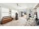 Sunroom featuring doors that open to the patio, a wood burning stove, and basic furnishings at 3075 S Emerson Way, Englewood, CO 80113