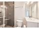 Modern bathroom featuring a glass shower and vanity with a sink at 3256 Federal Blvd, Denver, CO 80211