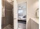 Modern bathroom with a glass-enclosed shower and a view into the bedroom at 3256 Federal Blvd, Denver, CO 80211