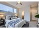 Comfortable bedroom with plush bedding, and access to the en-suite bathroom at 3256 Federal Blvd, Denver, CO 80211