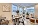 Modern dining area with stylish table and chairs, bathed in natural light at 3256 Federal Blvd, Denver, CO 80211