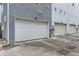 Row of private garages offering ample parking space, shown with neutral-toned exteriors and well-maintained surroundings at 3256 Federal Blvd, Denver, CO 80211