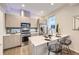 Modern kitchen featuring stainless steel appliances, sleek countertops, and ample cabinet space at 3256 Federal Blvd, Denver, CO 80211