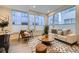 Bright living area with large windows, stylish seating, and neutral decor at 3256 Federal Blvd, Denver, CO 80211