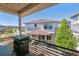 Balcony with black metal railing featuring a grill and views of the neighborhood at 2936 Merry Rest Way, Castle Rock, CO 80109