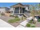 Stylish two-story home featuring a covered porch, modern siding, and well-kept xeriscaped front yard at 2936 Merry Rest Way, Castle Rock, CO 80109