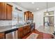 The well-lit kitchen has stainless steel appliances, tile backsplash and a undermounted sink at 2936 Merry Rest Way, Castle Rock, CO 80109