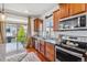 Bright kitchen features stainless steel appliances, hardwood floors and granite countertops at 2936 Merry Rest Way, Castle Rock, CO 80109