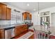 The well-lit kitchen has stainless steel appliances, tile backsplash and a undermounted sink at 2936 Merry Rest Way, Castle Rock, CO 80109