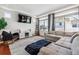 Inviting living room featuring a cozy sectional, TV, and decor-enhancing details, perfect for relaxing at 2936 Merry Rest Way, Castle Rock, CO 80109