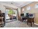 Home office with a work desk and sliding glass doors that lead to a private outdoor space at 2936 Merry Rest Way, Castle Rock, CO 80109