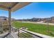 Enjoy community green space from this patio with iron railings and lovely views of the neighborhood at 2936 Merry Rest Way, Castle Rock, CO 80109