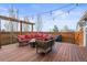 Outdoor deck provides ample seating with a modern fire pit, perfect for gatherings and relaxation at 7903 E 50Th Dr, Denver, CO 80238