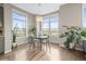 Dining room featuring a chandelier, a modern table, and big, bright windows at 7903 E 50Th Dr, Denver, CO 80238