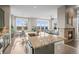 Spacious kitchen with granite countertops that connects to a cozy living area at 7903 E 50Th Dr, Denver, CO 80238
