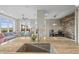 Bright, open-concept kitchen featuring granite countertops, a large island, and seamless flow to the living and dining areas at 7903 E 50Th Dr, Denver, CO 80238