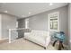 Bright room with white couch, gray walls, and a staircase at 7903 E 50Th Dr, Denver, CO 80238