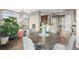 Open-concept space with a dining area, fireplace, and a modern kitchen at 7903 E 50Th Dr, Denver, CO 80238